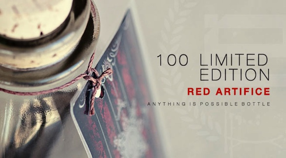 red artifice playing cards bottle